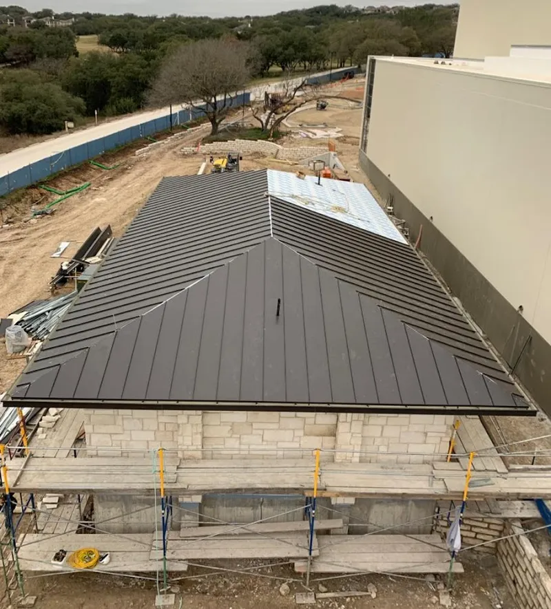 Metal roof new construction with scaffolding in Byram